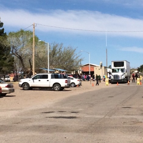 After the proceedings...Roadrunner Food Bank truck puls up to the Columbus park where locals wait for food distribution